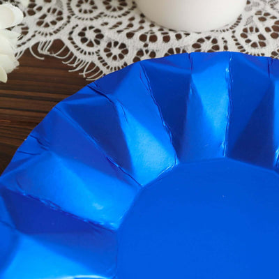 Blue paper plate with a decorative edge on a lace tablecloth.