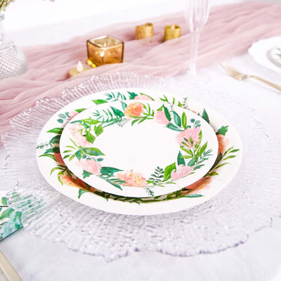 Floral paper plates stacked on a decorative placemat