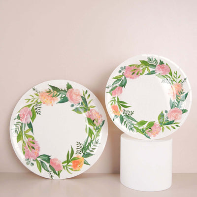 Floral design paper plates in a circle arrangement on a light background.