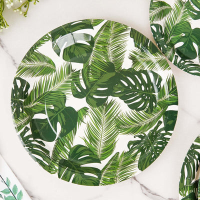 Palm leaf patterned plate on a marble surface.