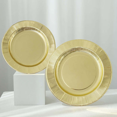 Gold decorative plates on display against a soft background.