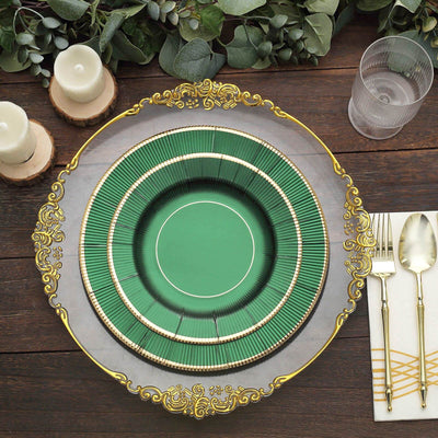 Elegant green and gold dining plate set on a rustic wooden table.