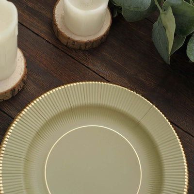 Elegant green plate with gold rim on a rustic wooden table.