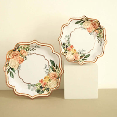 Floral decorative plates in a scalloped design against a neutral background.