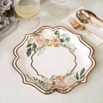 Floral decorative plate with rose gold accents on a light background.