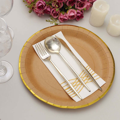 Gold-trimmed paper plate with cutlery and napkin, styled for dining.