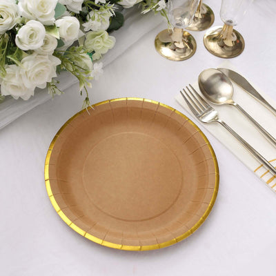 Brown paper plate with gold trim on a table setting with flowers and utensils.