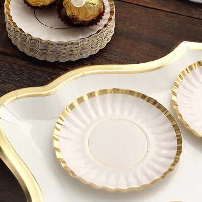 Elegant disposable plates with gold trim, perfect for parties and events.