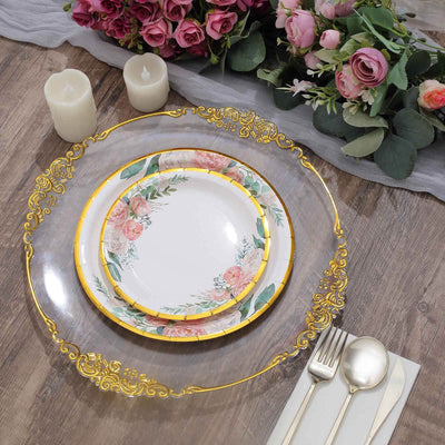 Elegant floral dinnerware set with decorative gold accents on a rustic wooden table.