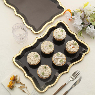 Elegant dessert platter with assorted decorated cookies and floral accents.