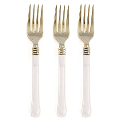 Set of three elegant gold and white forks on a plain backdrop