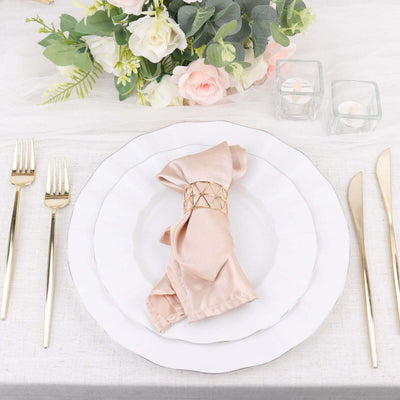 Elegant table setting with a napkin and floral centerpiece.