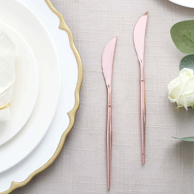 Rose gold serving knives on a textured tablecloth