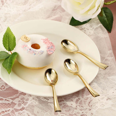 Decorative dessert with gold spoons on a lace tablecloth.