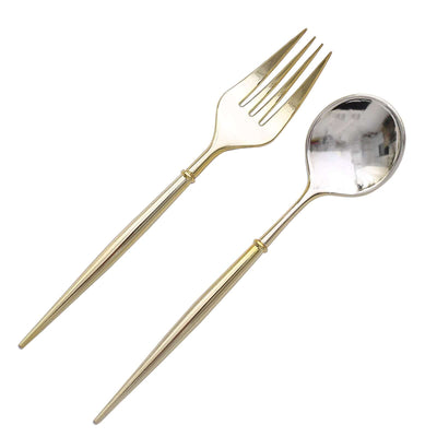 Gold serving fork and spoon set on white background.