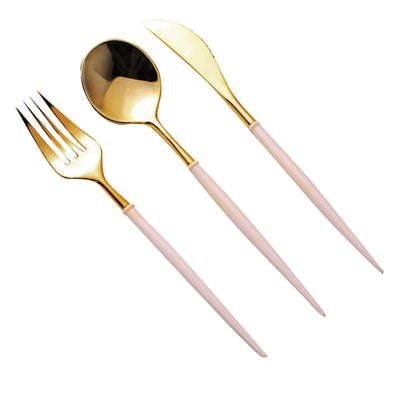Gold and white cutlery set including fork, spoon, and knife