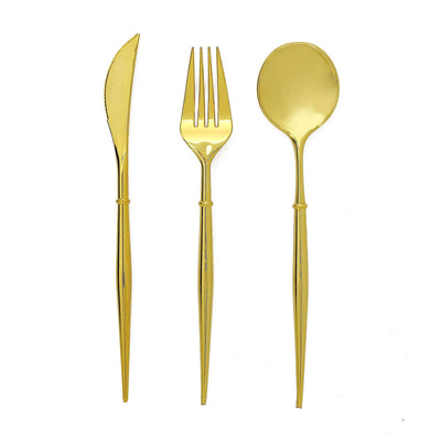 Gold cutlery set including knife, fork, and spoon on a white background.