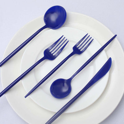Blue plastic cutlery set on white plates