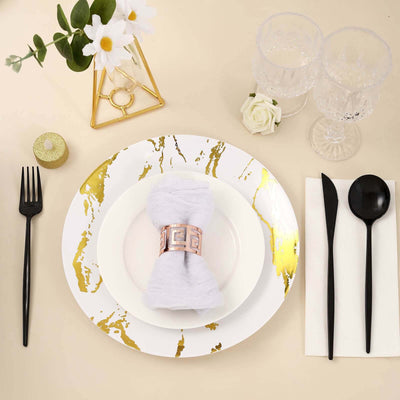 Elegant dining table setting with gold accents and modern tableware.