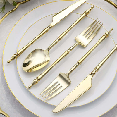 Golden cutlery set on elegant white plate