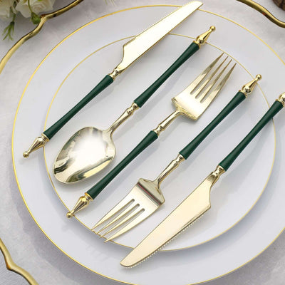 Elegant gold and green flatware set on a styled table setting.