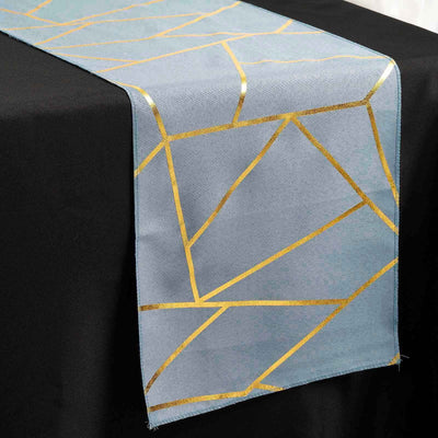 Blue table runner with gold geometric pattern on a black table.
