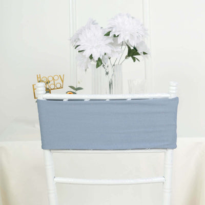 Blue chair cover on a white chair against a plain background.
