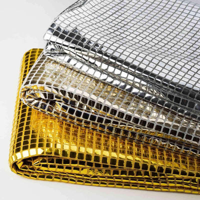 Three metallic mesh fabrics in silver, gold, and bronze stacked neatly.