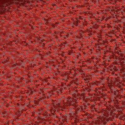 Red sequined fabric with intricate texture and shimmering details.