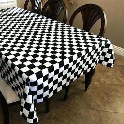 Black and white checkered tablecloth on a dining table.