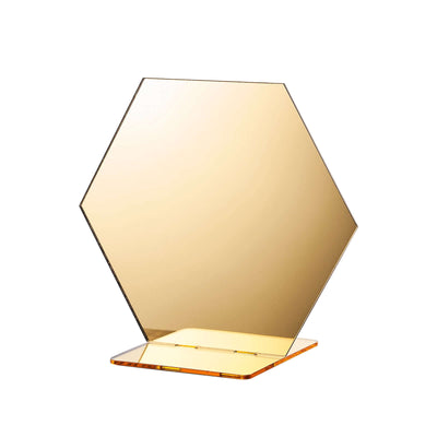 Hexagon-shaped decorative mirror with a gold tint on a clear base.
