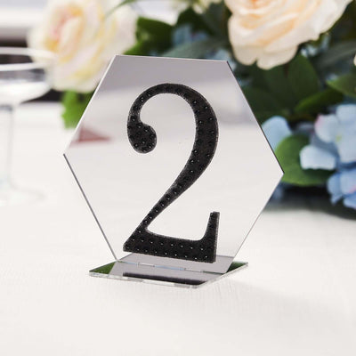 Black glitter number 2 table centerpiece in a hexagon shape