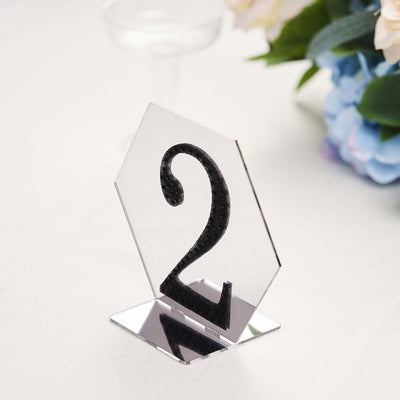 Hexagonal table number sign featuring a bold black '2' on a reflective base.