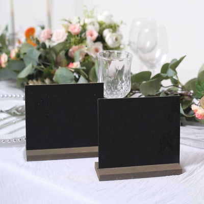 Black chalkboard signs with wooden bases for events or displays