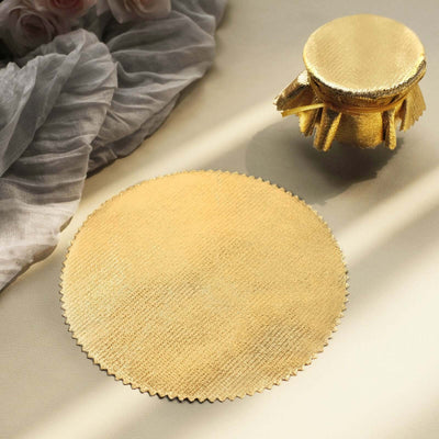 Gold round placemat and matching jar lid on a soft background.