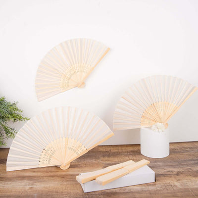 Decorative hand fans in various sizes displayed against a neutral background.