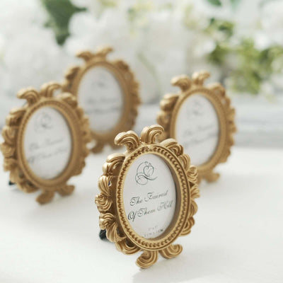 Elegant gold photo frames with floral designs for tabletop display.