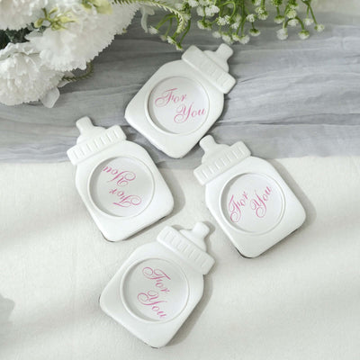 White decorative coasters with "For You" text in pink.