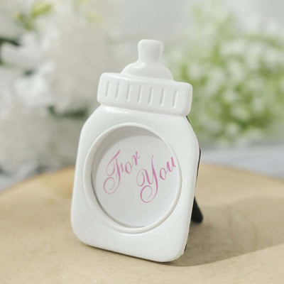 White photo frame with "For You" text, standing on a wooden surface.