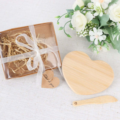 Heart-shaped bamboo cutting board gift set with box and knife.