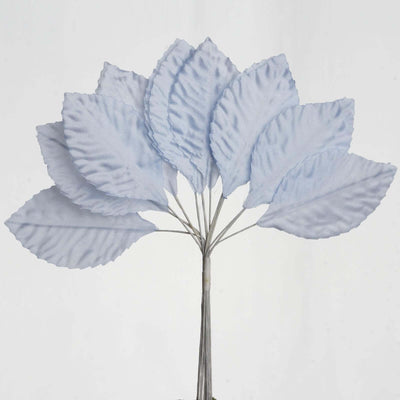 Blue fabric leaves bouquet on a plain backdrop.