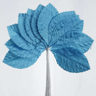 Blue fabric flower petals arranged in a fan shape on a stem.