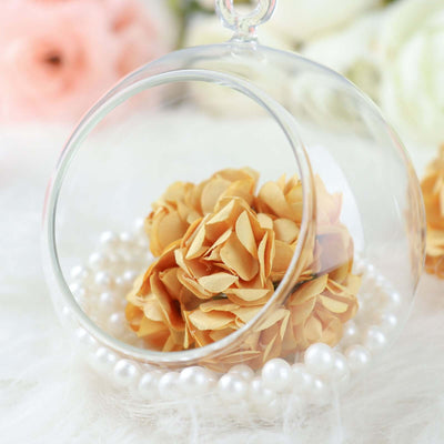 Decorative glass terrarium with dried flowers and pearls