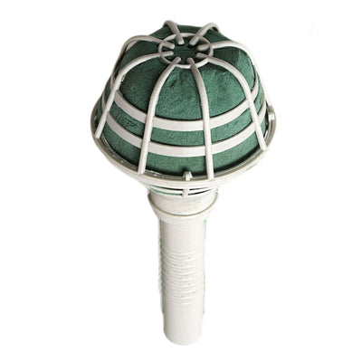 Green and white air filter with a mesh design on a plain background