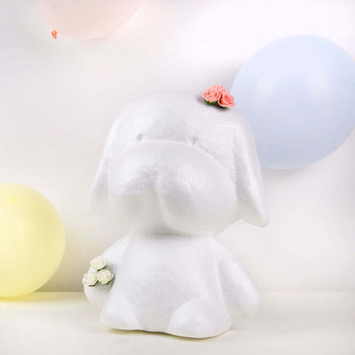 White dog figurine with flower accents, playful party atmosphere.