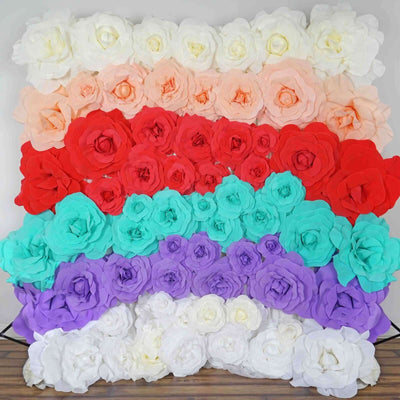 Colorful paper flower wall decoration in various shades of red, pink, blue, and purple.