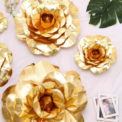 Gold paper flower wall decor in various sizes, perfect for home or event decoration.