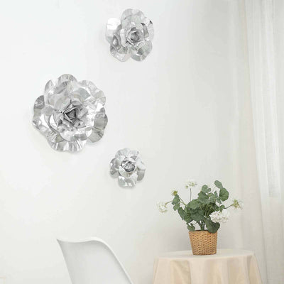 Silver metal flower wall decor in a modern interior setting.
