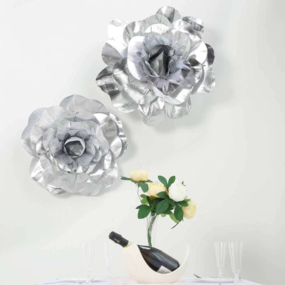 Silver floral wall decor set with two large flower designs.
