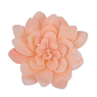 Peach artificial flower with layered petals on a white background